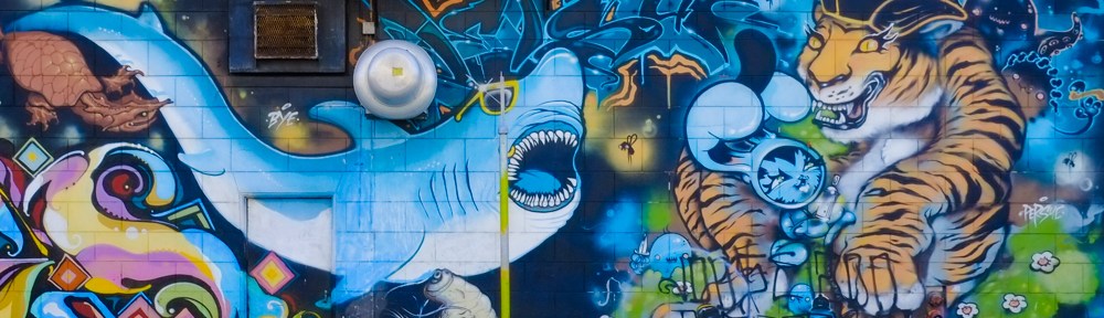part of a mural by Persue, or Bunny Kitty, in Mission District of San Francisco, shark versus tiger,