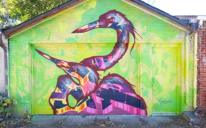 street art mural on garage door in Miriam Garfinkle Lane by Sebas Perez Vincenti