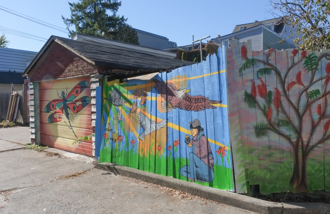 street art mural on garage door in Miriam Garfinkle Lane by April Grace