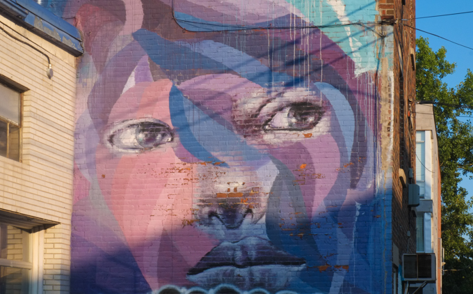 mural, large face in shades of pink, blue, and purple, by Melsa Montagne and Philippe Mastrocola