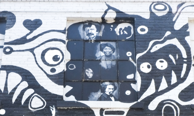 part of the Springfield mural, portraits in a blobby mouth eith teeth and many eyes