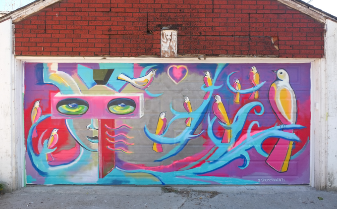 street art mural on garage door in Miriam Garfinkle Lane, by Thelia Shelton