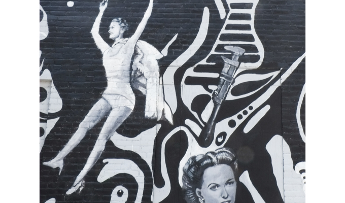 part of the Springfield mural, two women, a wrench,