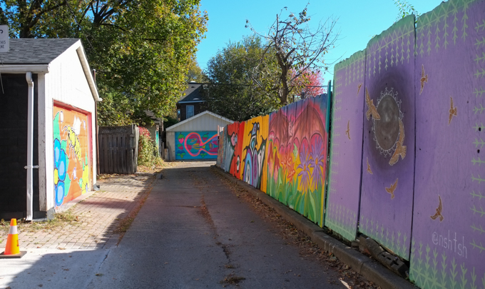 a few street art murals on garage doors in Miriam Garfinkle Lane, including a purple one by Nishina